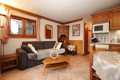 a living room with a couch and a table at Résidence Les Hauts De Chavants - Hauts de chavants Albert 1er n°3 MAE-2651 in Les Houches