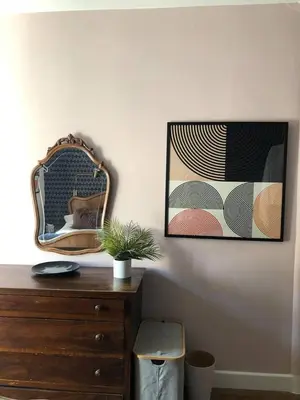 a room with a dresser and a mirror on a wall at La Residence, Beautiful Comfort in Saint-Gervais-les-Bains