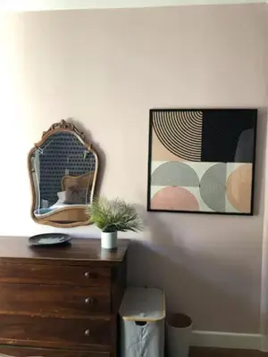 a room with a dresser and a mirror on a wall at La Residence, Beautiful Comfort in Saint-Gervais-les-Bains