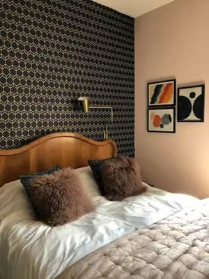 a bed with two pillows on it in a bedroom at La Residence, Beautiful Comfort in Saint-Gervais-les-Bains