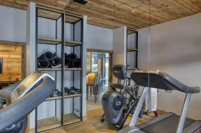 a gym with two exercise bikes in a room at Chalet Ascension in Combloux