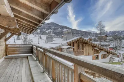 a winter view from the balcony of a log cabin at Chalet Alpestre in Combloux