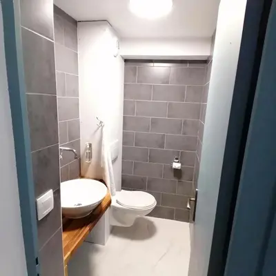 a bathroom with a toilet and a sink at Au petit Névé in Les Houches