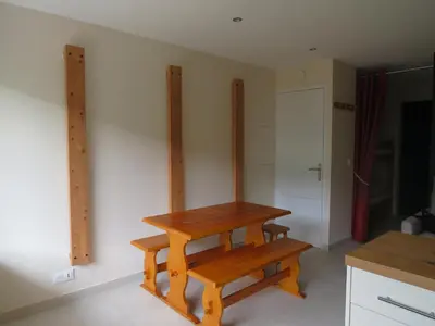 a wooden bench sitting on a wall in a kitchen at Magnifique studio Megève in Megève