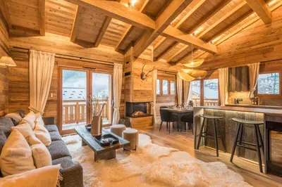 a living room with a couch and a table at Appartement Mady - Welkeys in Megève