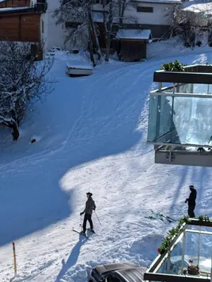a person is skiing down a snow covered slope at Appartement avec vue magnifique in Saint-Gervais-les-Bains