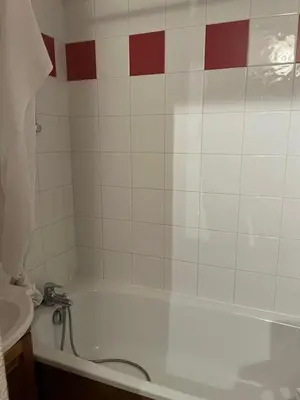 a bathroom with a bath tub and a sink at Samoëns 2 in Samoëns
