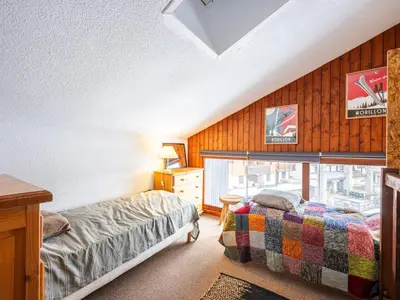 a bedroom with two beds and a window at Le Doina 2 N08 - ST5M in Morillon