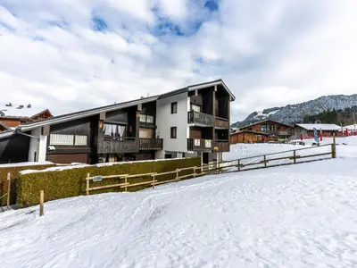 a building in the snow with a snow covered yard at Le Doina 2 N08 - ST5M in Morillon