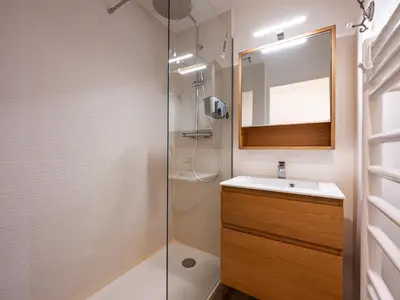 a bathroom with a shower and a sink and a mirror at Le Doina 2 N08 - ST5M in Morillon