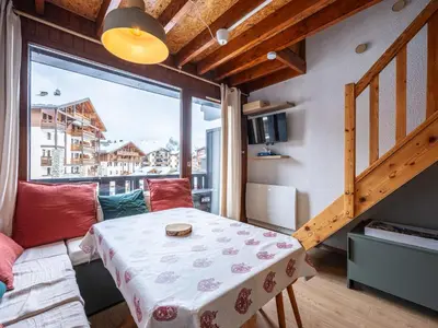 a small room with a table and a large window at Le Doina 2 N08 - ST5M in Morillon