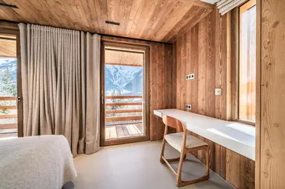 a bedroom with a desk and a window at Chalet Foxden, Les Houches Chamonix - by EMERALD STAY in Les Houches