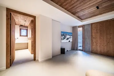 an empty room with wood paneling and a door at Chalet Foxden, Les Houches Chamonix - by EMERALD STAY in Les Houches