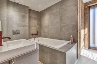 a large bathroom with a tub and a sink at RUBY - Luxurious duplex 180 m2 in Chamonix-Mont-Blanc