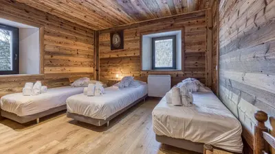 a bathroom with a tub and a sink and a shower at Chalet Grelettes in Les Houches