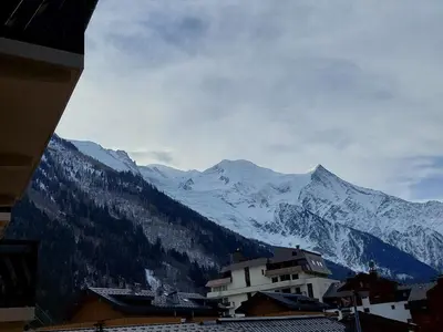 a view of a mountain range with snow covered mountains at Appartement cosy avec balcon et parking à Chamonix, proche centre-ville - FR-1-517-70 in Chamonix-Mont-Blanc