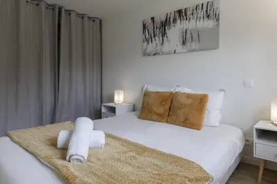 a bedroom with a bed with towels on it at Pierre Belle - 80m2 - Grande Terrasse et Jardin in Chamonix-Mont-Blanc