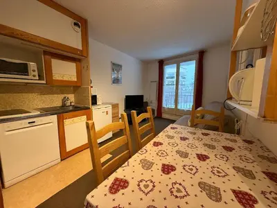 a kitchen with a table and a kitchen with a dining room at 2P Chamonix Aiguille du Midi in Chamonix-Mont-Blanc