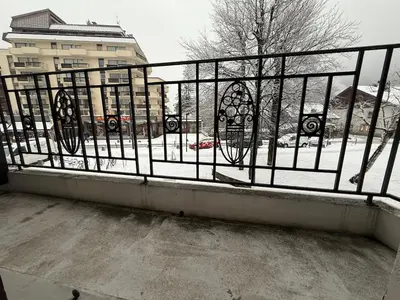 a balcony with a fence with snow on the ground at 2P Chamonix Aiguille du Midi in Chamonix-Mont-Blanc