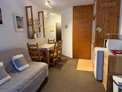 a living room with a couch and a table at 2P Chamonix Aiguille du Midi in Chamonix-Mont-Blanc