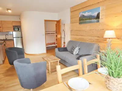 a living room with a couch and a table at Appartement T2 6 pers avec Wifi et parking couvert - FR-1-629-145 in Samoëns