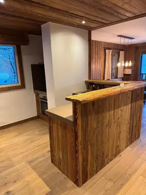 a kitchen with a wooden counter in a room at Fairway in Megève