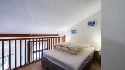 a bedroom with a bed and a balcony at Grand Horizon 1 N401 - 3P6 in Morillon