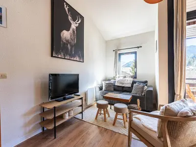 a living room with a television and a couch at Grand Horizon 1 N401 - 3P6 in Morillon