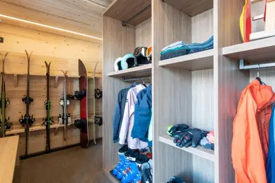 a walk in closet with skis and snowboards at Chalet Eteila vue incroyable ! Combloux 10 min de Megève in Combloux