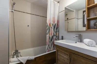 a bathroom with a sink and a shower at Les Arolles - Duplex familial - Vue montagne in Les Houches