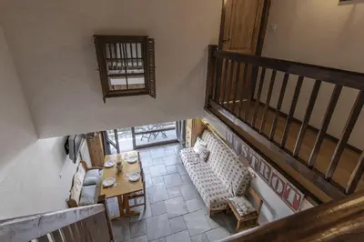 an overhead view of a living room with a table and chairs at Les Arolles - Duplex familial - Vue montagne in Les Houches