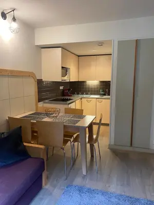 a kitchen and dining room with a table and chairs at Havre de paix à Flaine in Arâches-la-Frasse