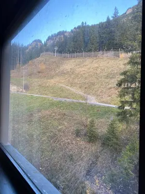 a view of a field from a window at Havre de paix à Flaine in Arâches-la-Frasse