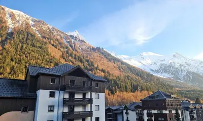 a building with a view of a mountain at La Floria, Vue Mont Blanc in Chamonix-Mont-Blanc