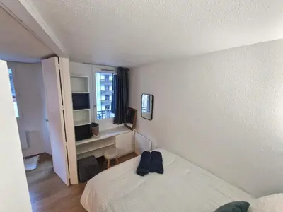 a hotel room with a bed and a window at La Floria, Vue Mont Blanc in Chamonix-Mont-Blanc