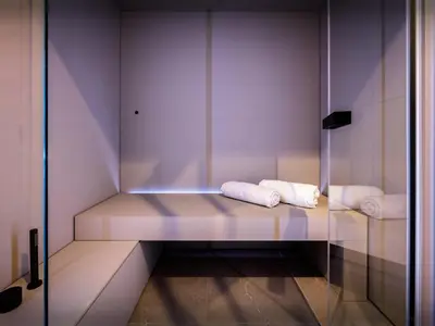 a room with two towels sitting on a bench at Chalet Ellambra - OVO Network in Combloux