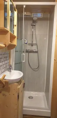 a bathroom with a shower and a sink at Les Vardasses - Chalet typique avec jardin et vue sur les montagnes in Les Houches