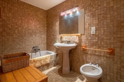 a bathroom with a sink and a toilet and a tub at Nice apartment with Mont Blanc balcony's view in Chamonix-Mont-Blanc