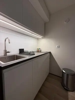 a kitchen with a sink and a counter top at Joli 2P Mummery centre-ville de Chamonix in Chamonix-Mont-Blanc