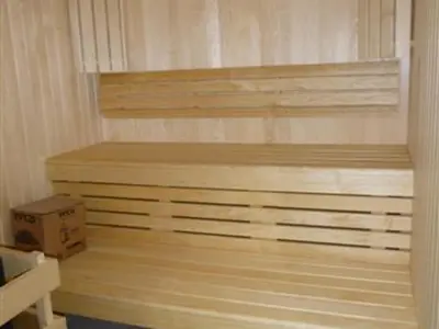 a bedroom with a bed and a box at Spacieux appartement avec parking et accès piscine à Flaine - FR-1-425-231 in Arâches-la-Frasse