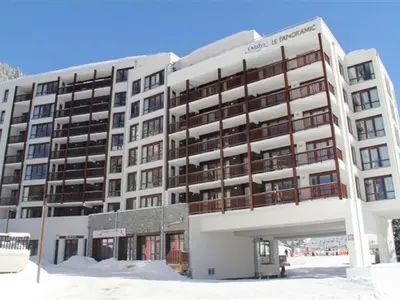 a large white building in the snow at Spacieux appartement avec parking et accès piscine à Flaine - FR-1-425-231 in Arâches-la-Frasse
