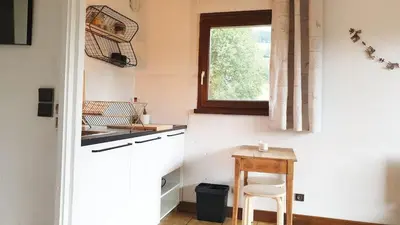 a wooden bench sitting on top of a balcony at Le Refuge Alpin in Cordon