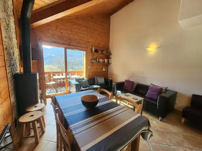 a living room with a couch and a table at Appartement 4 pièces avec Wifi et parking à Samoëns - FR-1-629-146 in Samoëns