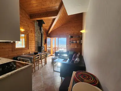 a living room with couches and a table and chairs at Appartement 4 pièces avec Wifi et parking à Samoëns - FR-1-629-146 in Samoëns