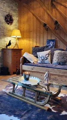 a living room with a couch and a coffee table at Alpen Marvel in Morillon