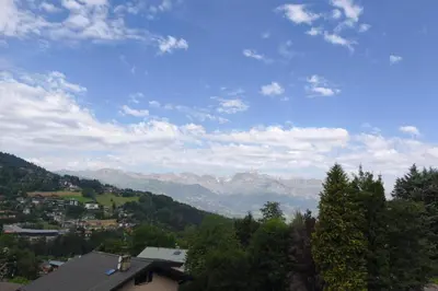 a view of a town with mountains in the background at Apartment near city center in Saint-Gervais-les-Bains