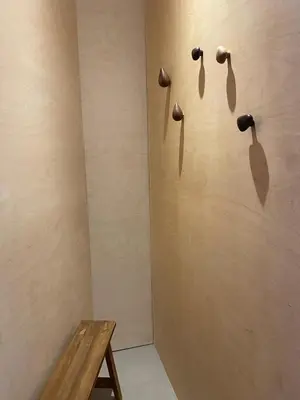 a room with a wooden wall with a wooden table at Appartement Chamonix in Chamonix-Mont-Blanc