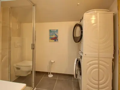 a bathroom with a toilet and a glass shower at Bel appartement neuf 8 pers, Samoëns, près village, WIFI inclus - FR-1-642-100 in Samoëns
