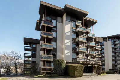 a building with balconies on the side of it at Le Castel des Roches - Sejour ski & spa in Saint-Gervais-les-Bains