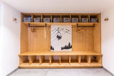 a shelf in a room with a picture of a swing at Chalet Croc Blanc, Chamonix - vu massif exceptionnel in Les Houches